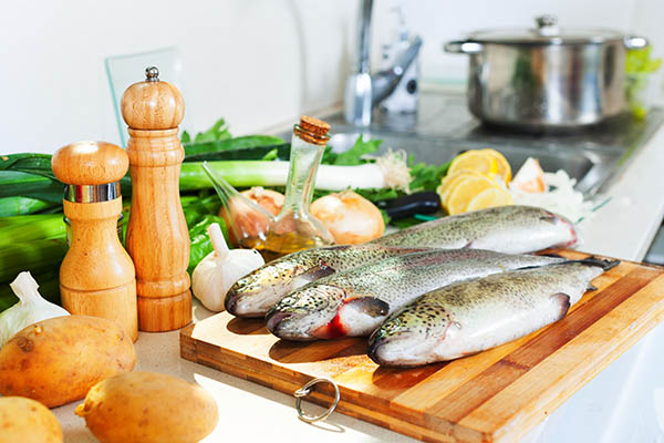 raw fresh trout in kitchen