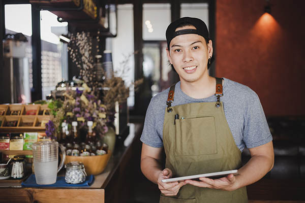 barista holding a tablet
