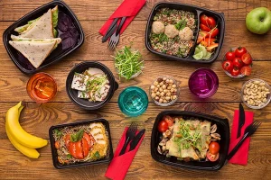 Healthy Pre-packaged Meals on Wooden Surface
