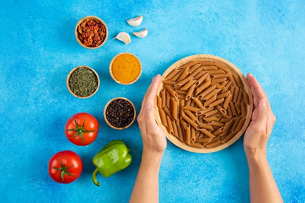 fresh organic vegetables with raw pasta and spices