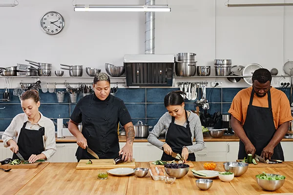 Culinary Team Prepping Vegetables in a Commercial Kitchen
