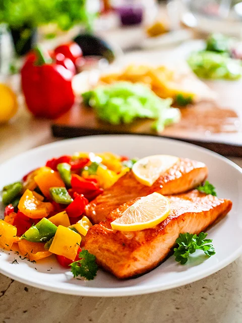 salmon with roasted peppers and lemon slice